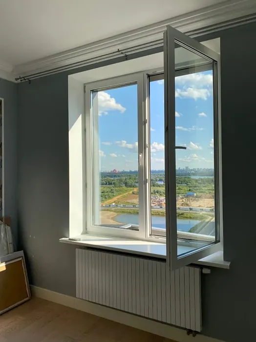 Light blue bedroom interior with paint Tikkurila K492